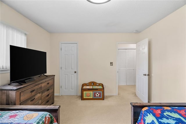 bedroom featuring baseboards and carpet flooring