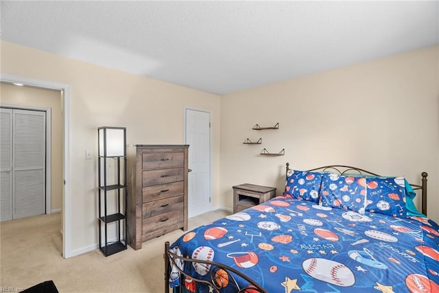 bedroom featuring baseboards and carpet