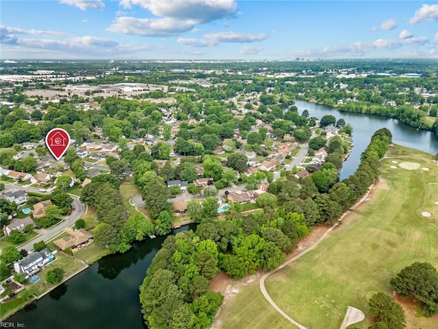 birds eye view of property featuring a water view, view of golf course, and a residential view
