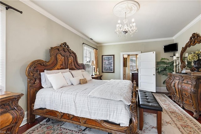 bedroom with baseboards, a notable chandelier, ornamental molding, and wood finished floors
