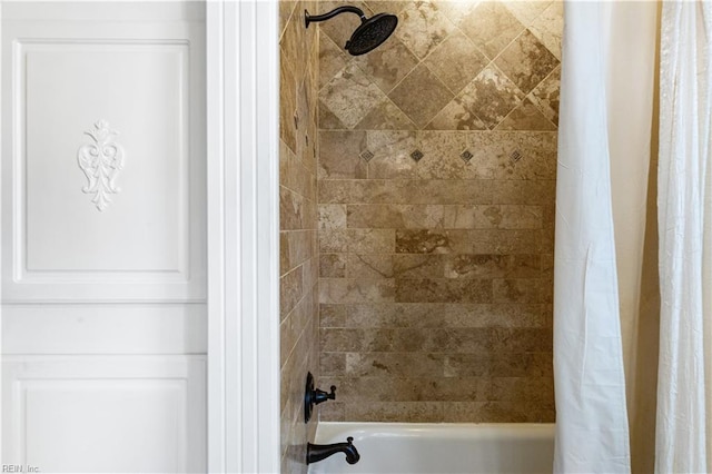 bathroom featuring shower / bath combo with shower curtain