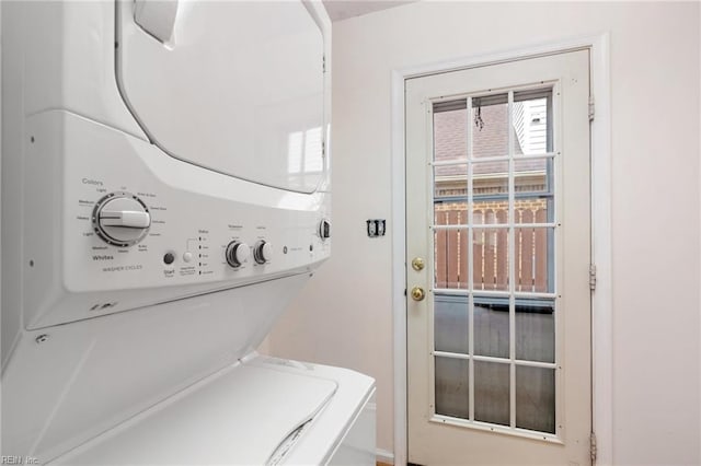 laundry room with stacked washer / drying machine