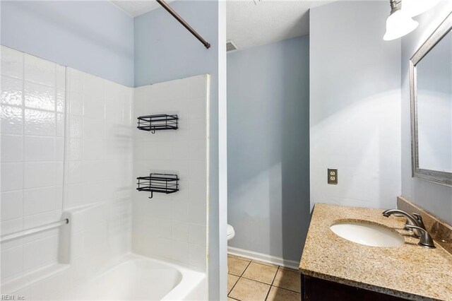 full bathroom featuring toilet, vanity, visible vents, tile patterned floors, and shower / bath combination