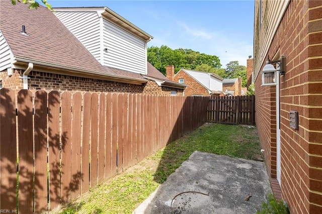 view of yard featuring a patio and a fenced backyard