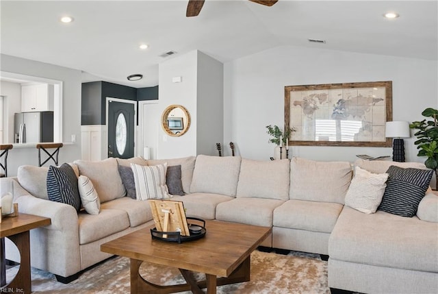 living room with recessed lighting, ceiling fan, visible vents, and lofted ceiling