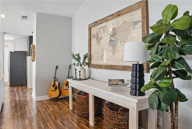 hall featuring recessed lighting, baseboards, visible vents, and wood finished floors