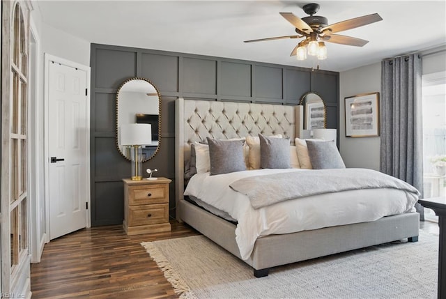 bedroom featuring a ceiling fan and dark wood-type flooring
