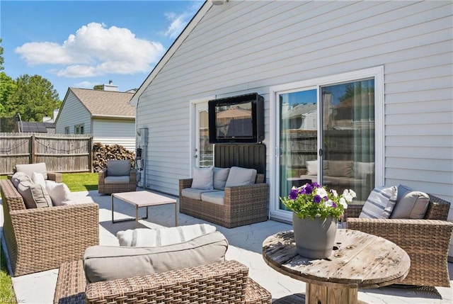 view of patio / terrace featuring fence and outdoor lounge area