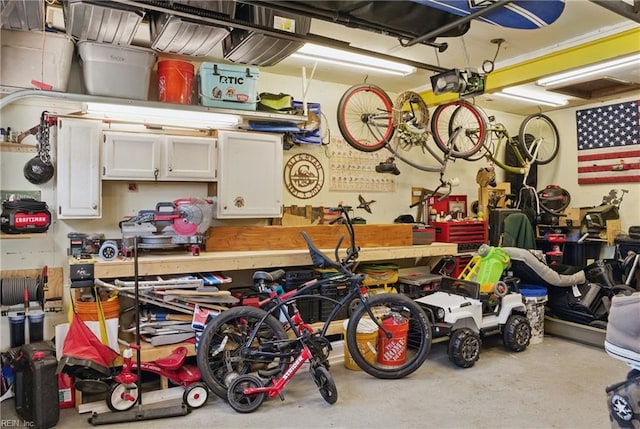garage featuring a workshop area and a garage door opener