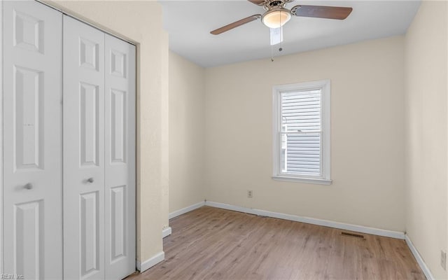 921 Quash St, Hampton, VA 23669 - unfurnished bedroom with a closet, visible vents, baseboards, a ceiling fan, and light wood-style flooring