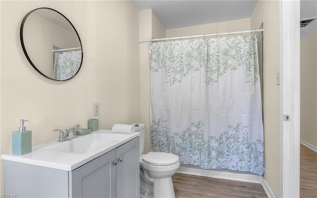 921 Quash St, Hampton, VA 23669 - bathroom featuring curtained shower, wood finished floors, vanity, baseboards, and toilet
