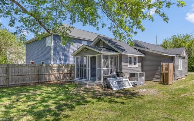 921 Quash St, Hampton, VA 23669 - rear view of property featuring fence, cooling unit, a sunroom, a shingled roof, and a yard