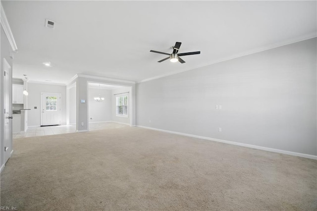 unfurnished living room with light colored carpet, ceiling fan with notable chandelier, baseboards, visible vents, and ornamental molding
