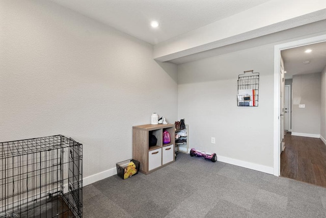 miscellaneous room with baseboards, recessed lighting, and carpet floors