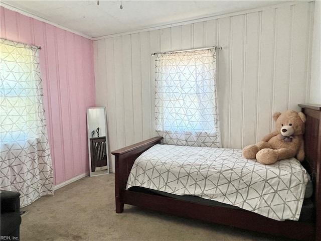 bedroom featuring carpet floors and crown molding