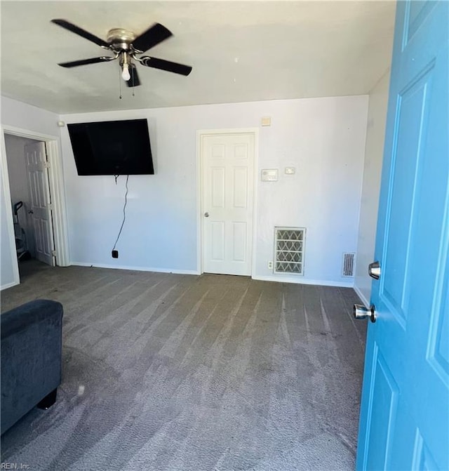 unfurnished living room with visible vents, carpet, ceiling fan, and baseboards