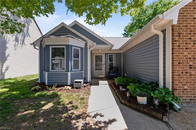 property entrance with brick siding