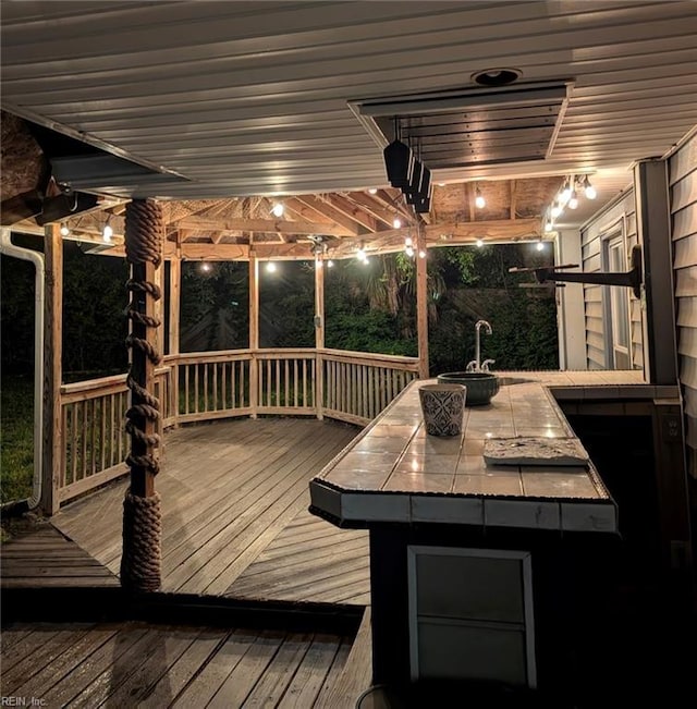 wooden terrace featuring a sink and outdoor dry bar
