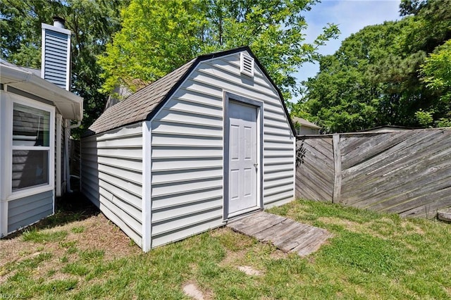 view of shed with fence