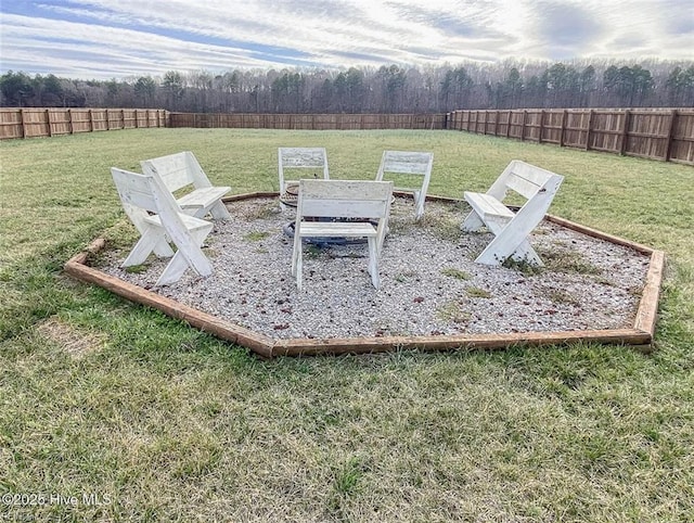 exterior space featuring a fenced backyard and a lawn
