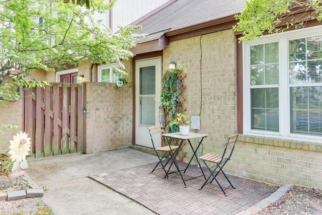 view of patio / terrace featuring fence and a gate