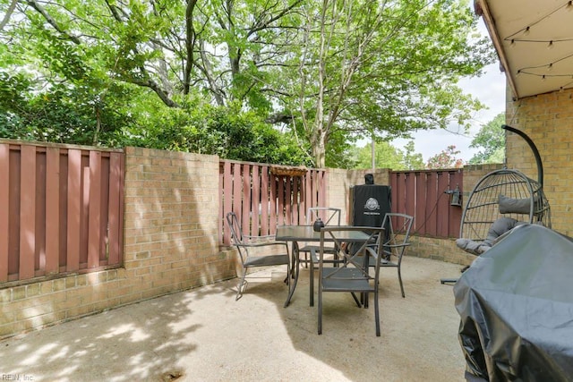 view of patio / terrace with a fenced backyard and outdoor dining area