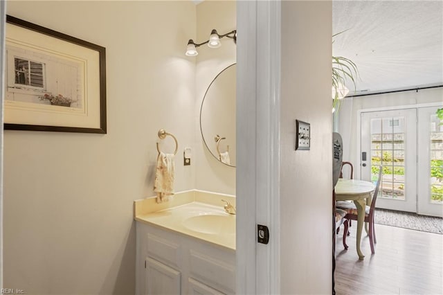 bathroom with vanity and wood finished floors