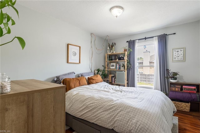 bedroom with wood finished floors