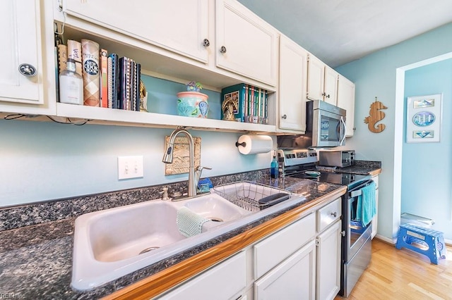 12 Rudee Ave, Virginia Beach, VA 23451 - kitchen with white cabinets, stainless steel appliances, open shelves, and a sink