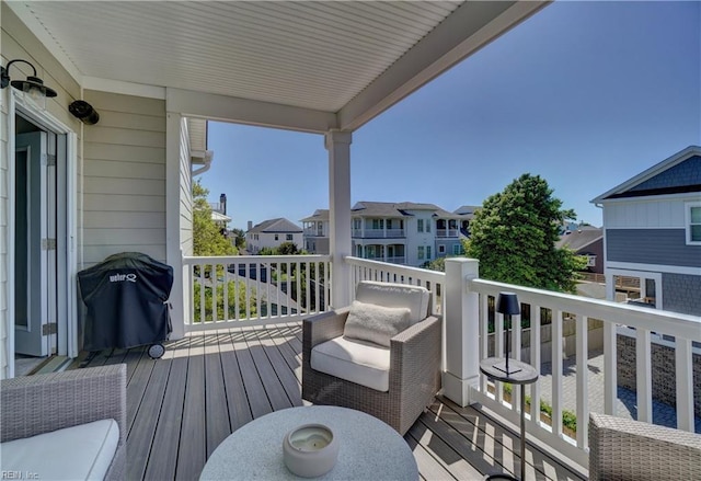balcony featuring a residential view and grilling area