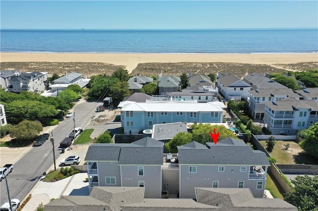 birds eye view of property with a residential view, a beach view, and a water view