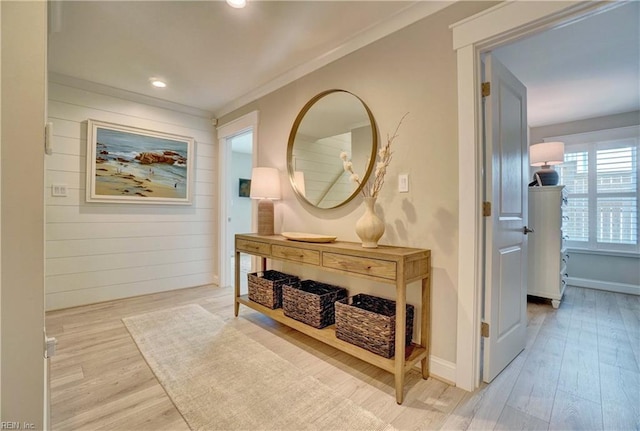hallway featuring crown molding, recessed lighting, baseboards, and wood finished floors