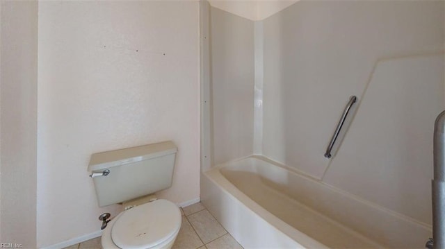 bathroom with toilet and tile patterned floors