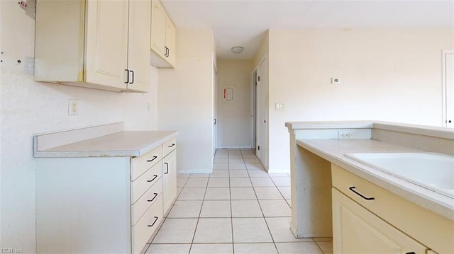 kitchen with light countertops and light tile patterned floors