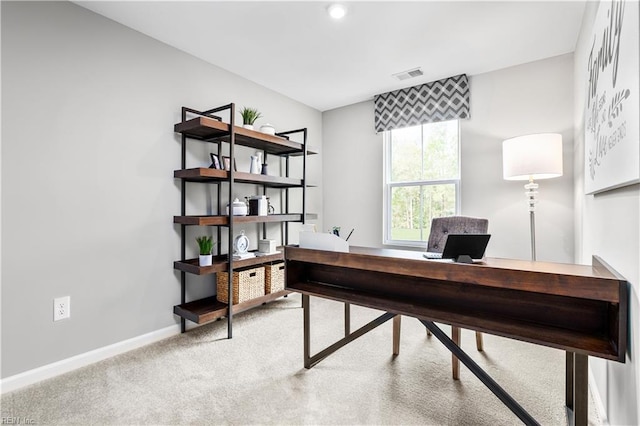 office space with visible vents, carpet, and baseboards