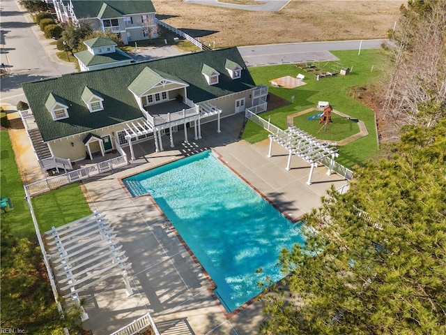 view of pool with a fenced in pool, fence, a yard, and a patio area