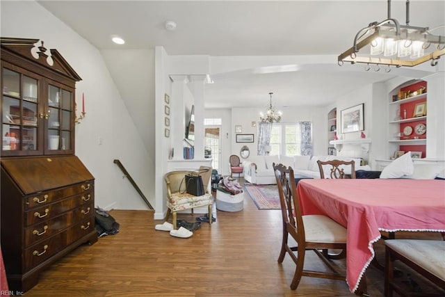 422 New London Pl, Virginia Beach, VA 23454 - dining room featuring an inviting chandelier, built in features, and wood finished floors