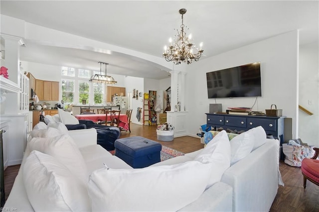422 New London Pl, Virginia Beach, VA 23454 - living room with an inviting chandelier, arched walkways, decorative columns, and wood finished floors