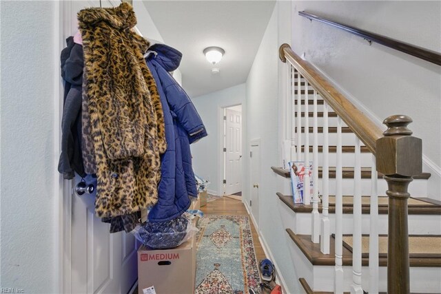 422 New London Pl, Virginia Beach, VA 23454 - hall featuring baseboards, wood finished floors, and stairway