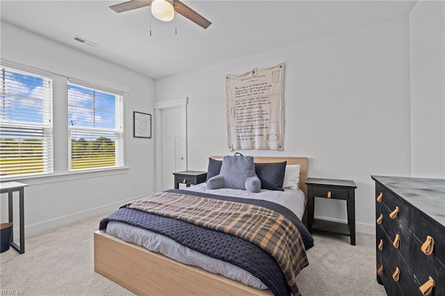 bedroom featuring visible vents, carpet flooring, and baseboards