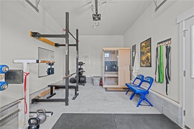 workout area with a garage