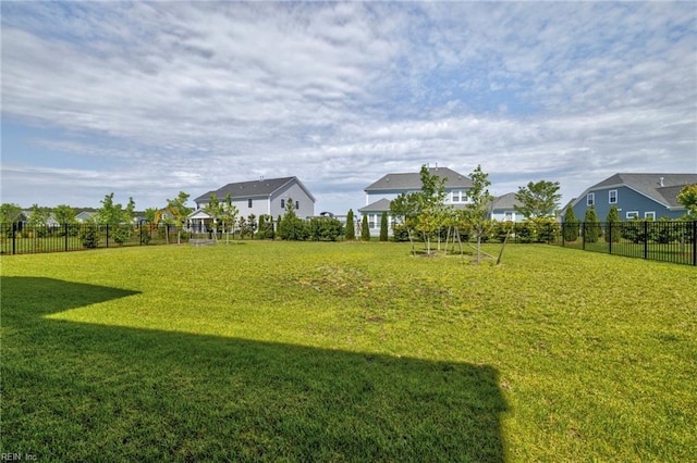 view of yard with fence and a residential view