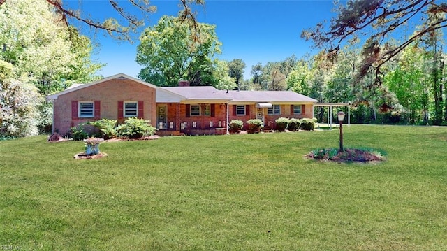 3702 Nansemond Pkwy, Suffolk, VA 23435 - ranch-style house featuring a front yard and brick siding