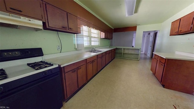 3702 Nansemond Pkwy, Suffolk, VA 23435 - kitchen featuring range with gas cooktop, under cabinet range hood, a sink, light countertops, and light flooring
