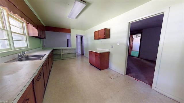 3702 Nansemond Pkwy, Suffolk, VA 23435 - kitchen featuring a sink, light countertops, and baseboards