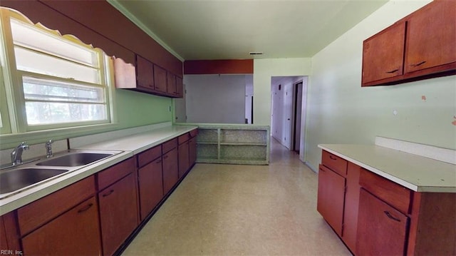 3702 Nansemond Pkwy, Suffolk, VA 23435 - kitchen featuring a sink, light countertops, and light floors