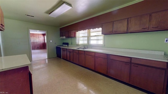 3702 Nansemond Pkwy, Suffolk, VA 23435 - kitchen with light countertops, range with electric stovetop, a sink, and light floors