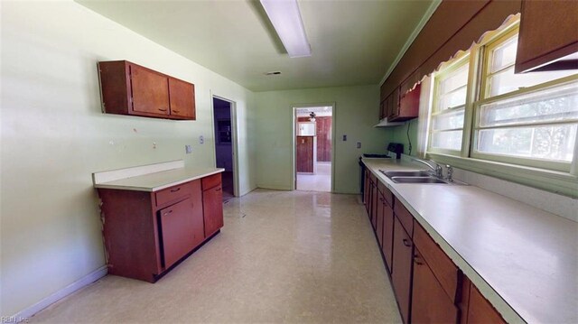 3702 Nansemond Pkwy, Suffolk, VA 23435 - kitchen featuring light countertops, a sink, and healthy amount of natural light