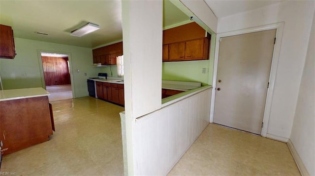 3702 Nansemond Pkwy, Suffolk, VA 23435 - kitchen with light flooring, electric stove, light countertops, and brown cabinets