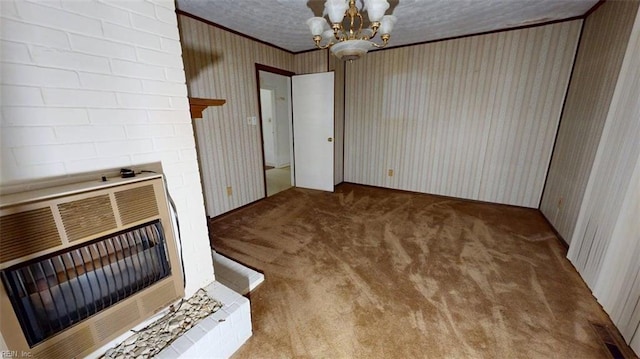3702 Nansemond Pkwy, Suffolk, VA 23435 - unfurnished dining area featuring heating unit, crown molding, carpet, wallpapered walls, and a chandelier
